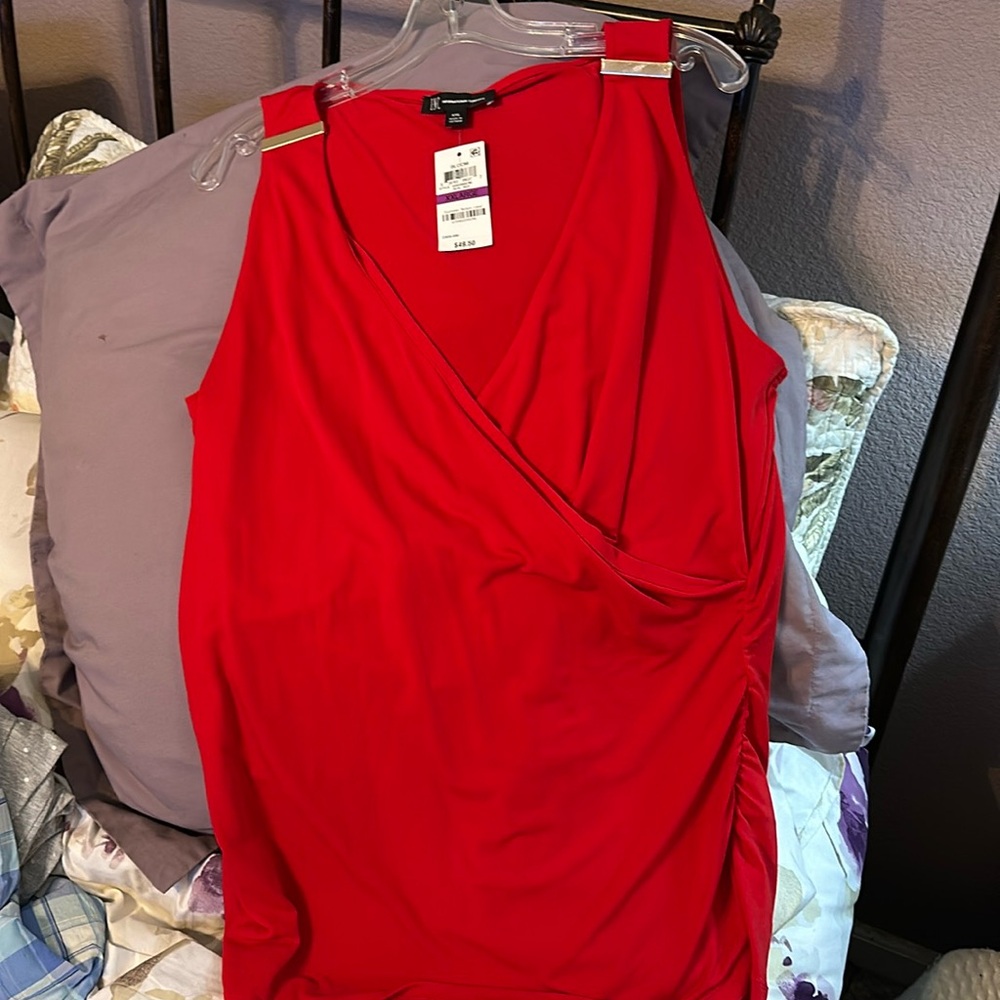 Brand new with tags INC red faux wrap stretchy top.